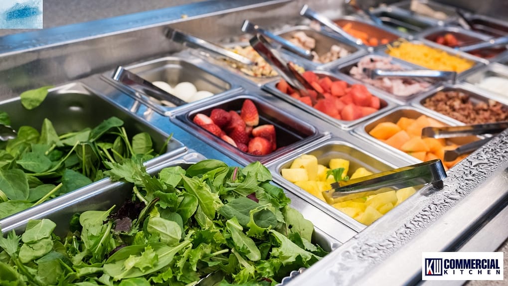 Australian café front counter with Class 4 glass-door commercial fridge showing ≤5 °C and staff applying a 2-hour/4-hour rule label