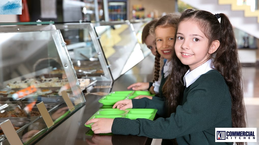 Australian school canteen with Class 4 glass-door fridge showing ≤5 °C and a covered benchtop salad bar during lunch service