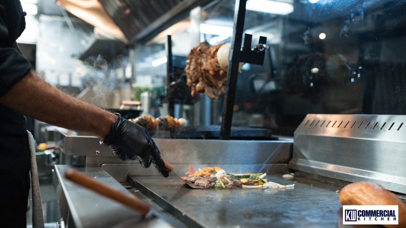 Electric griddle operating under an approved ductless filtration hood during inspection
