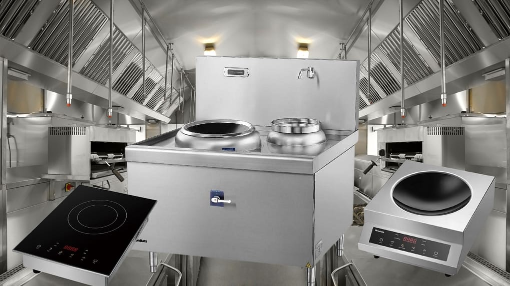Chef stir-frying on an induction wok beside a traditional gas wok burner in an Australian commercial kitchen under compliant AS 1668.2 ventilation
